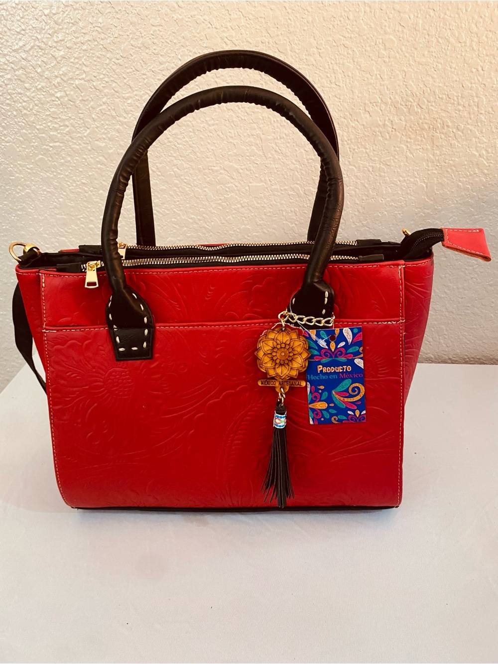 Red Women's Embossed Tote Bag with Tassel Charm